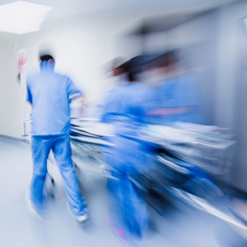 emergency medicine doctors transporting a patient