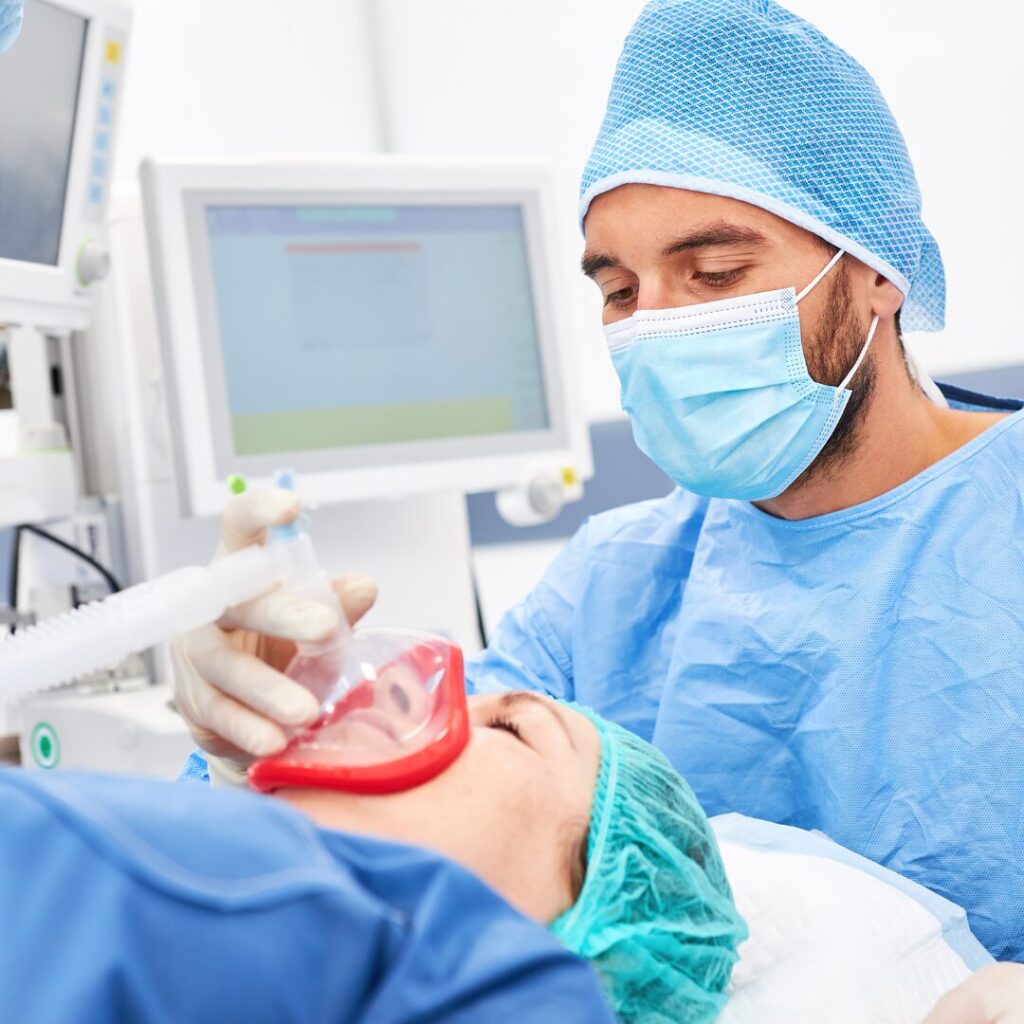 An anesthesiologist administering anesthesia to a patient