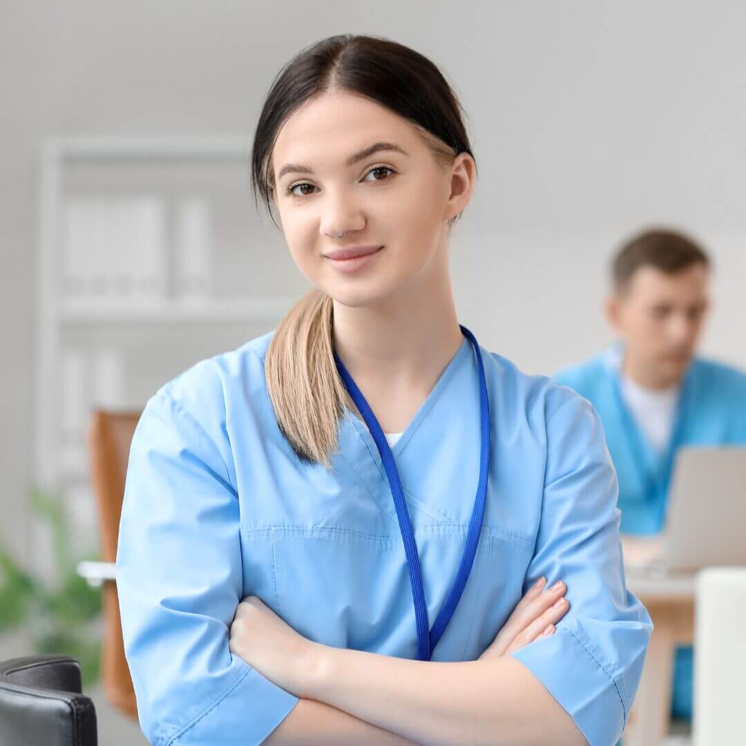 A nurse smiling at the camera